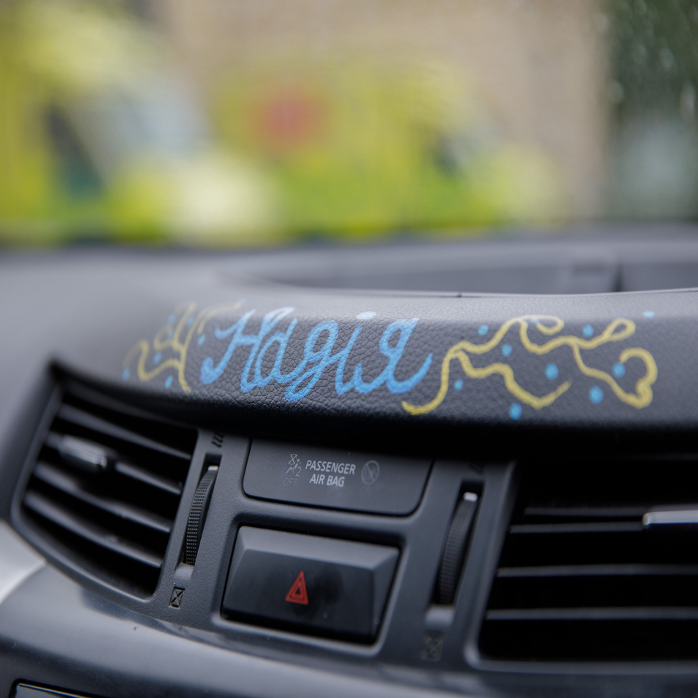 The word hope written on a vehicle dashboard