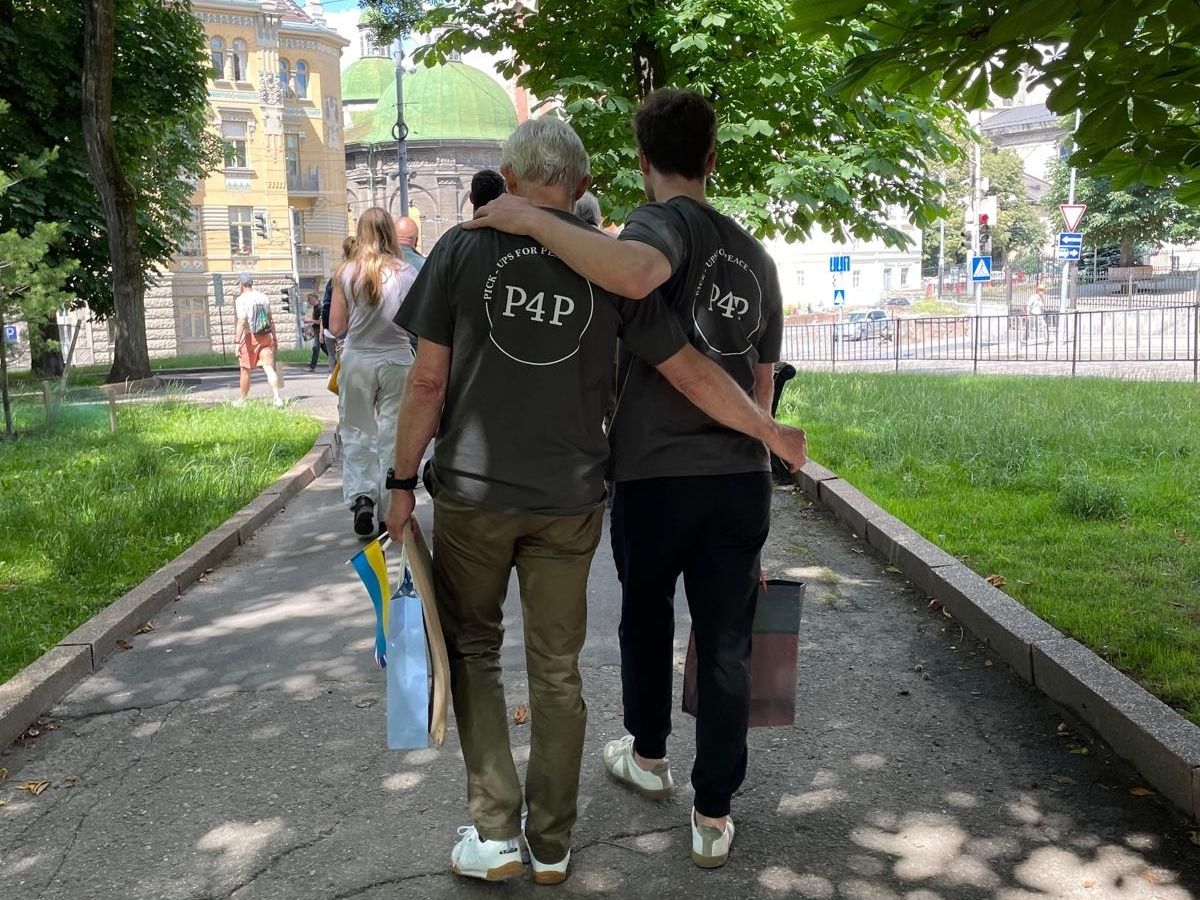 Two Pickups for Peace supporters walking together