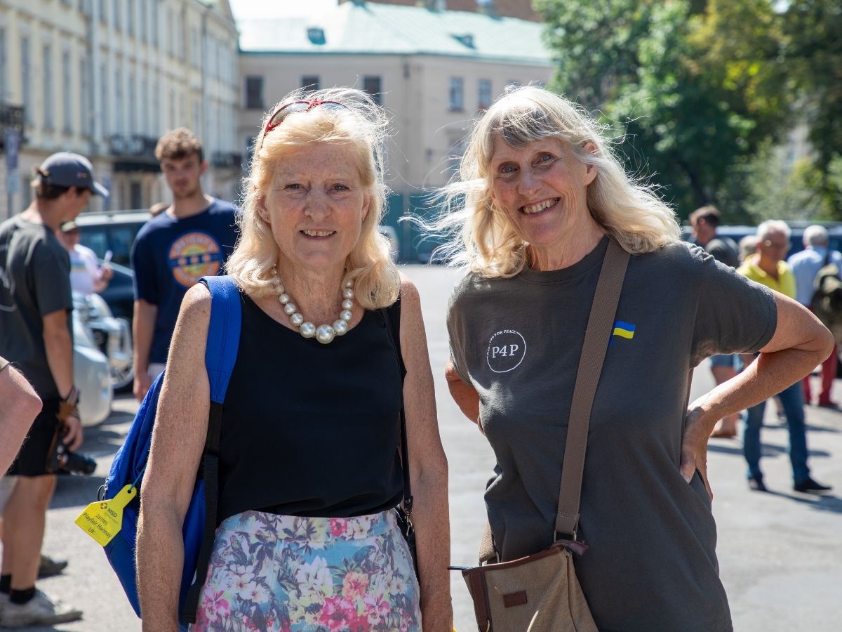 Two Pickups for Peace supporters walking together