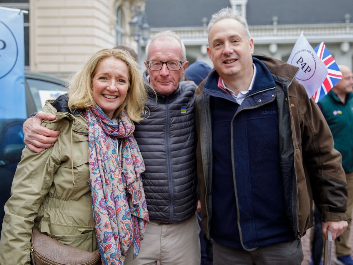 Two Pickups for Peace supporters walking together