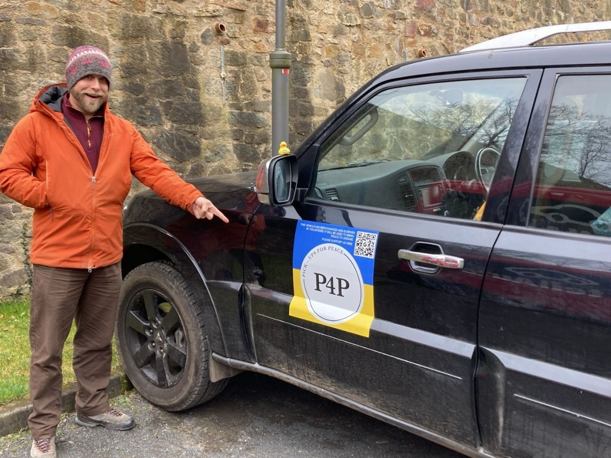 Two Pickups for Peace supporters walking together