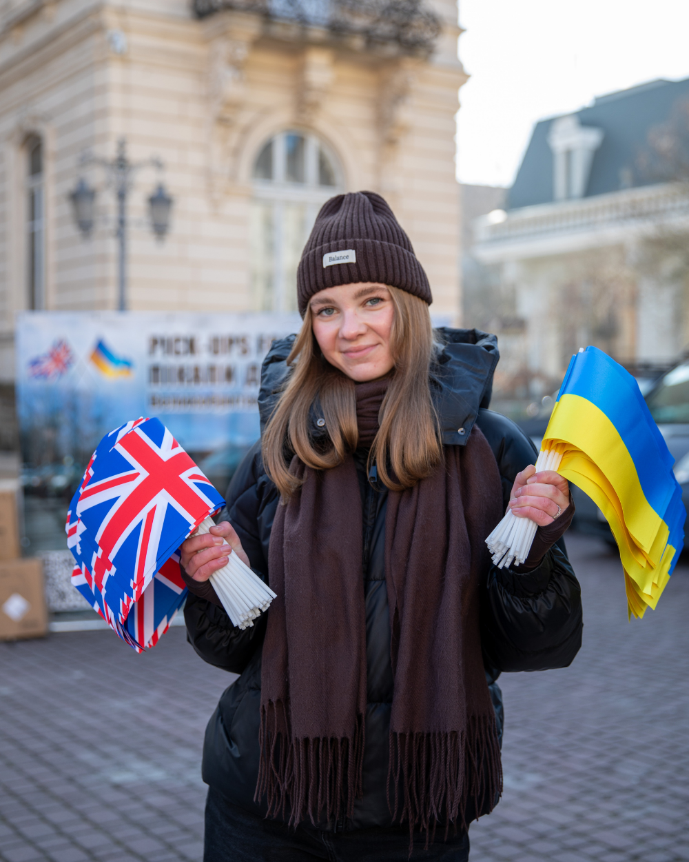 Pickups for Peace supporter holding UK and Ukrainian flags