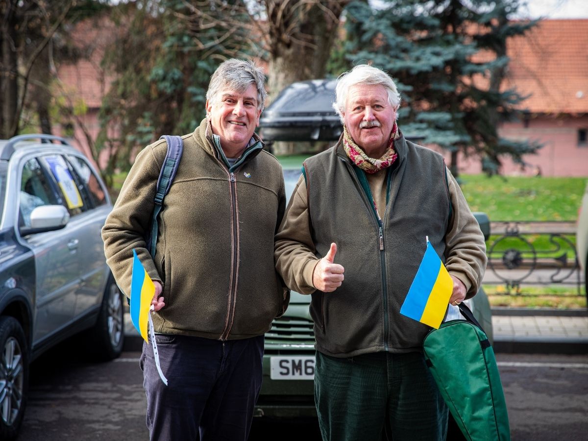 Supporters beside a Pickups for Peace vehicle