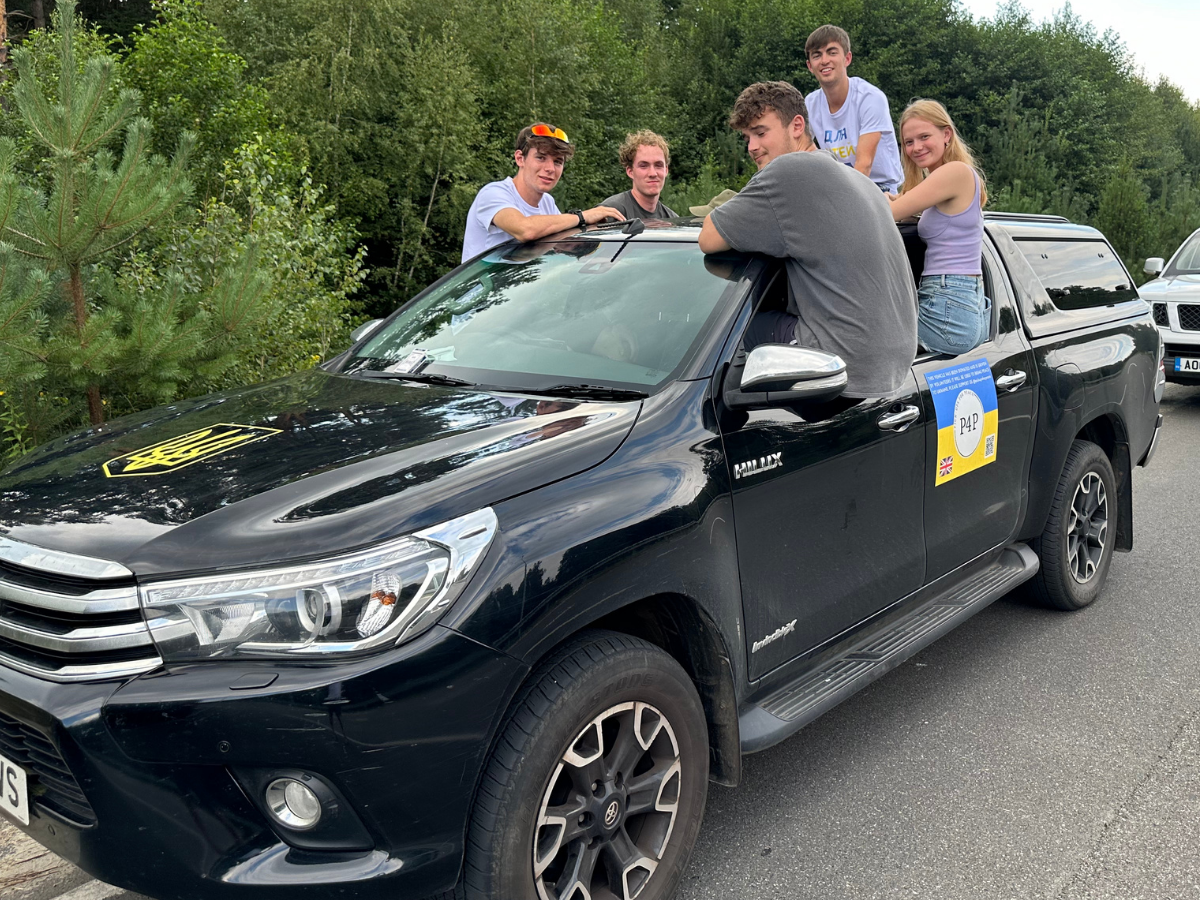 A Pickups for Peace vehicle with supporters