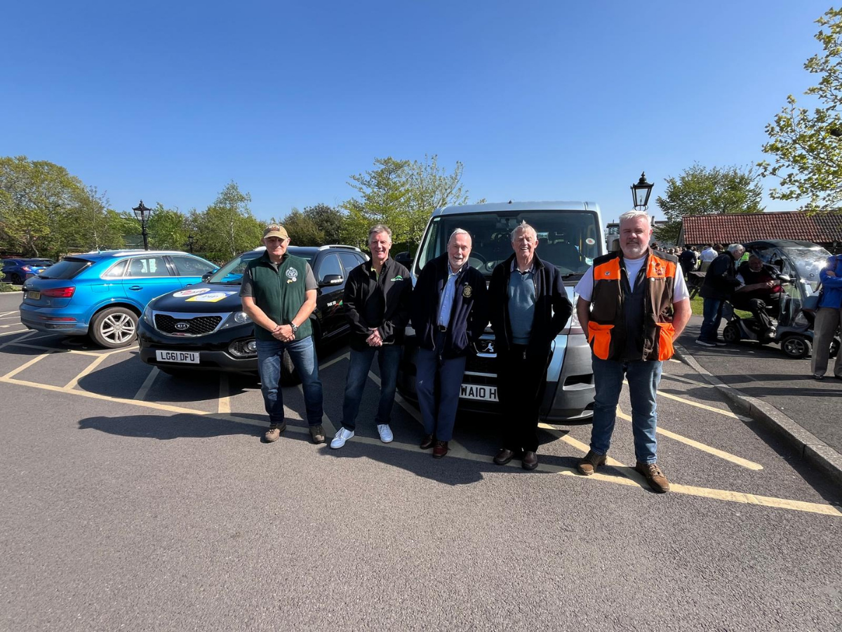 A group of Pickups for Peace supporters with vehicles