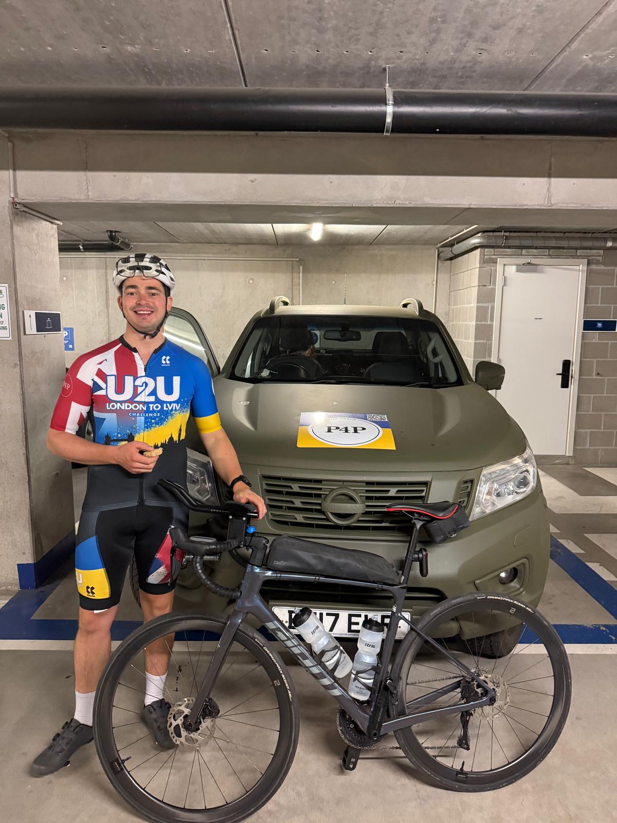 Matt with his bicycle beside the Pickups for Peace support vehicle at the start of Day 3