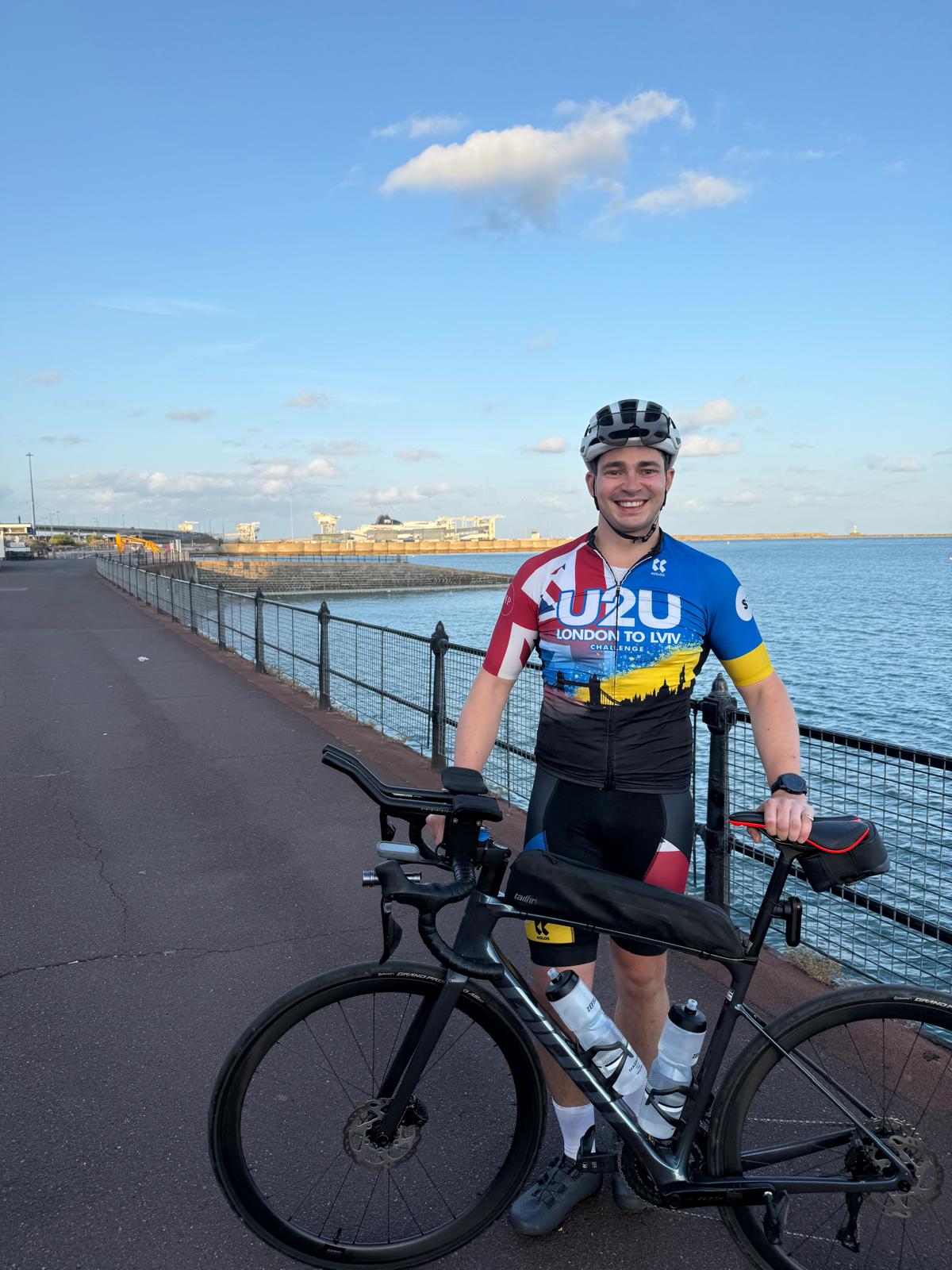 Matt Scarsi with his bicycle after reaching Dover on his London to Lviv ride